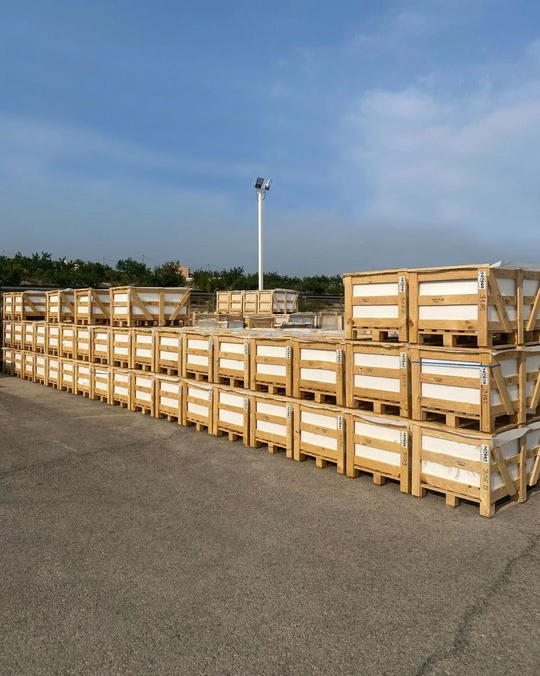 Fumigated wooden export crates of marble ready for container loading